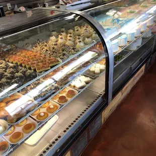 a variety of donuts in a display case