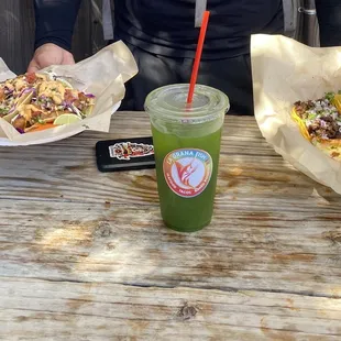 Fish tacos, spinach and pineapple agua Fresca and more tacos