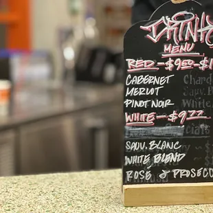 a menu board on a counter