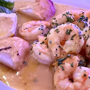 shrimp and scallops on a white plate
