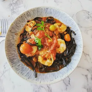 Sepia - cuttlefish ink pasta with calibrian tomato sauce and shrimp