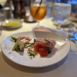 Two of the appetizers shared..  Fresh Buffalo Burrata (right) Carpaccio All&apos;italiana (left) . The Carpaccio All&apos;italiana was outstanding!