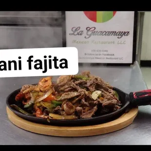 Steak chicken and shrimp fajita