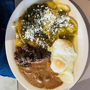 Chilaquiles Verdes with Barbacoa, Over Easy Eggs and Refried Beans