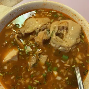 a bowl of soup with a spoon
