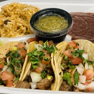 Tacos with rice and beans.