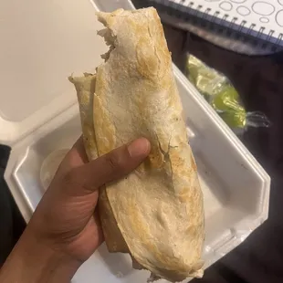 huge carne asada burrito + sour cream &amp; limes from La Guanaca