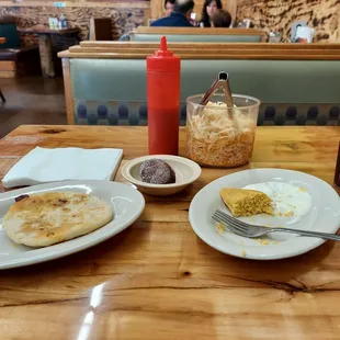 Chorizo pupusa, plantain empanada, tamale de elote,and Jamica juice.