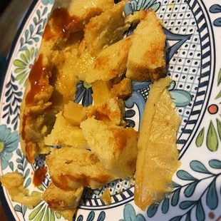 a person holding a plate of food