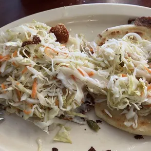 2 pupusas  de queso con su encurtido!!! Im not a fan of the red salsa but they do provide it as well !! enjoy !! Buen provecho!!