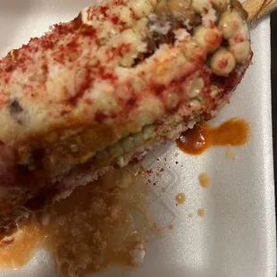 a piece of pizza on a fork