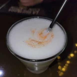 a drink with a spoon in it