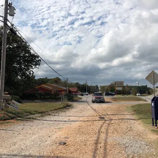 a person walking down a dirt road