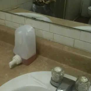 Oh, you have to pick up the whole dispenser to use it.