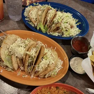 Chicken and beef hard tacos side of rice and beans