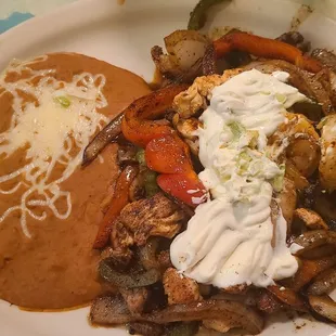 Texas Fajita's - Steak, Chicken and Shrimp served with grilled onions, mushrooms, peppers &amp; 4 tortillas. Excellent! Great bargain $8.95.