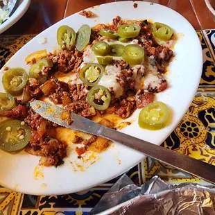 "Queso" fundidio with chorizo. = plate of chorizo with 4 dabs of cheese.  VERY DISAPPOINTING AND NO OFFER TO CORRECT