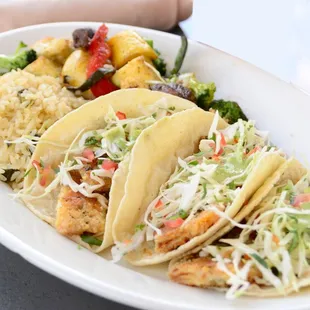 a plate of tacos and rice