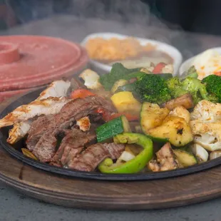 a plate of meat and vegetables