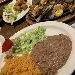 Refried beans, rice, guac &amp; lettuce, fajita veggies, and fried mushrooms