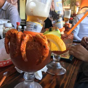 a glass of beer and a bloody drink