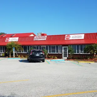 a car parked in front of the restaurant