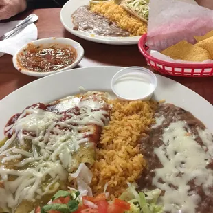 Enchilada platter (foreground) tacos in the background.