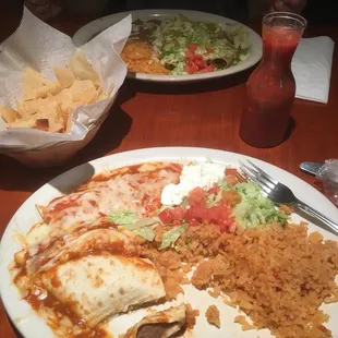 Bean and cheese burrito with Spanish rice and verde enchiladas! The chips and salsa were so good!