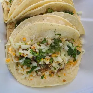 Ground beef tacos w/ corn tortillas.