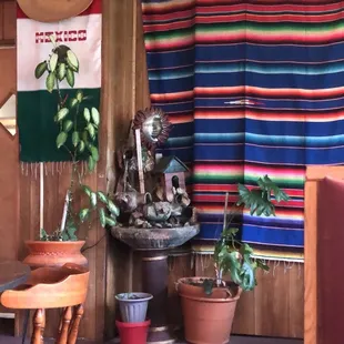a table and chairs in a mexican restaurant