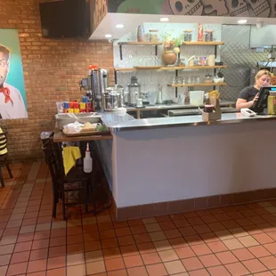 a woman behind the counter