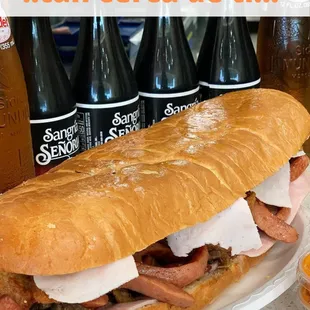 a large sub sandwich with meat and cheese