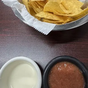Chips, salsa and white queso.