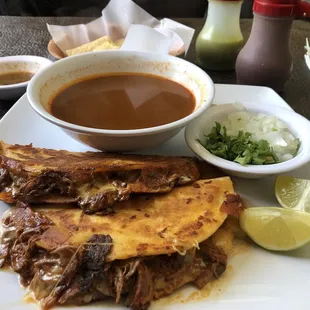 Birria quesadilla plate with consommé