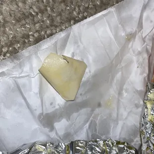 a piece of cheese on foil