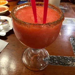 a bloody drink with red straws