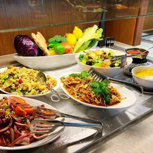 a variety of food on a buffet table