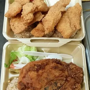 two trays of fried chicken and rice