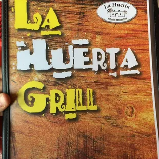 a hand holding a cookbook