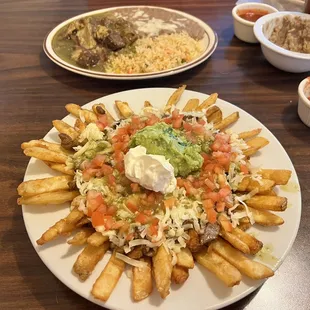 Nacho Fries with Asada (no jalapeños) and Chile Verde. Complimentary salsa and green chile bean dip.
