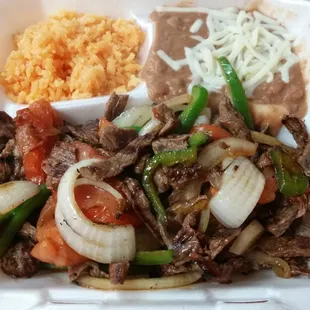 Steak fajitas with rice and beans.