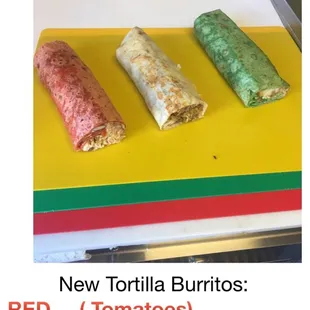 Tomatoes tortilla, (red),flour tortillas (white) and spinach tortilla (green).