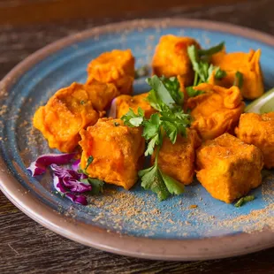a plate of food on a wooden table