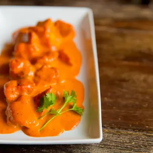 a plate of food on a wooden table