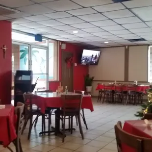 tables and chairs with red tablecloths