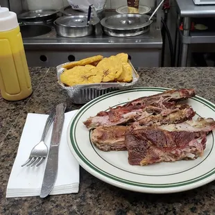 Costillas and tostones, $10 together (not including tup), perfect.