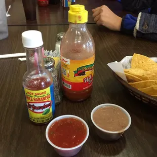 Hot sauces ready at the table.