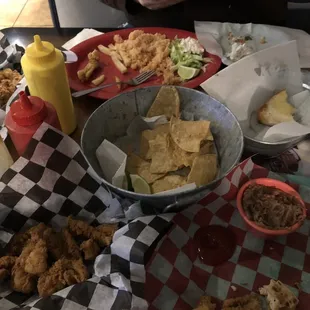 Fish nuggets, left over rice (tasteless), refried beans (gross), chips and salsa were the best thing pictured.