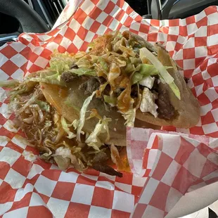 Gordita's  filled with beans, meat, lettuce, cheese, and salsa