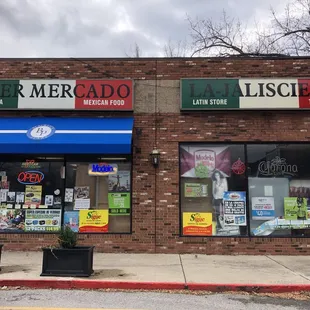 Small Mexican Restaurant on left side, Mexican grocery on the right have of the space.